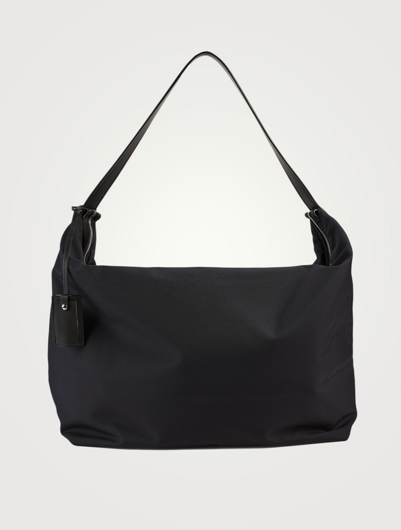 The row hot sale sling bag