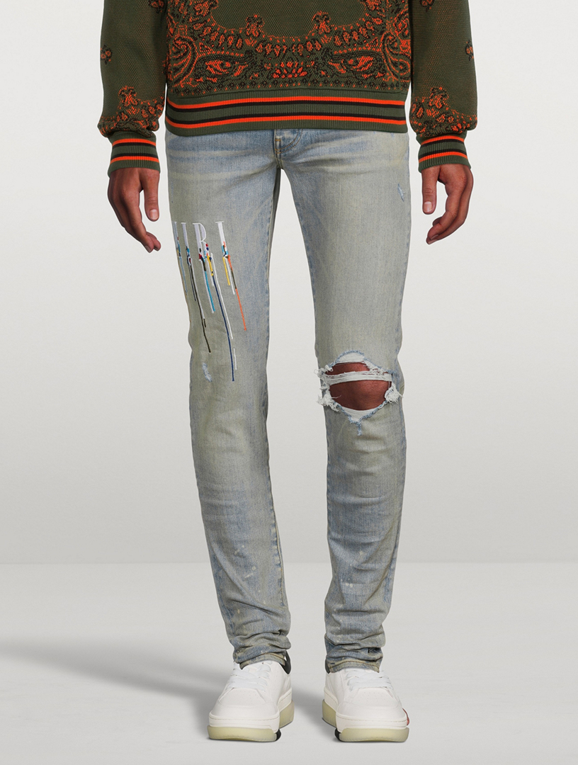 AMIRI Paint Drip Logo Skinny Jeans