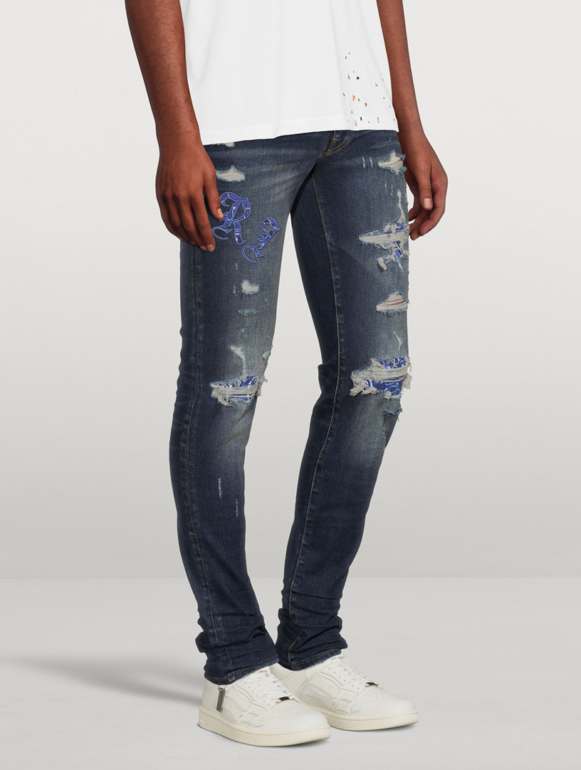 AMIRI Old English Logo Skinny Jeans | Holt Renfrew