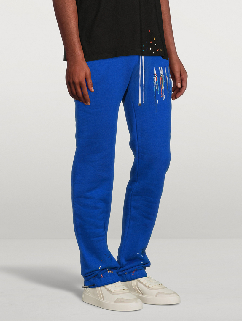 paint-drip logo track pants, AMIRI