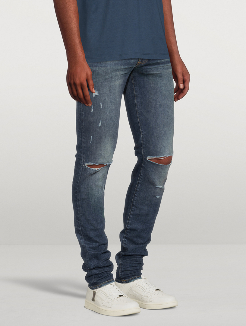 AMIRI Slash Skinny Jeans With Knee Rip | Holt Renfrew