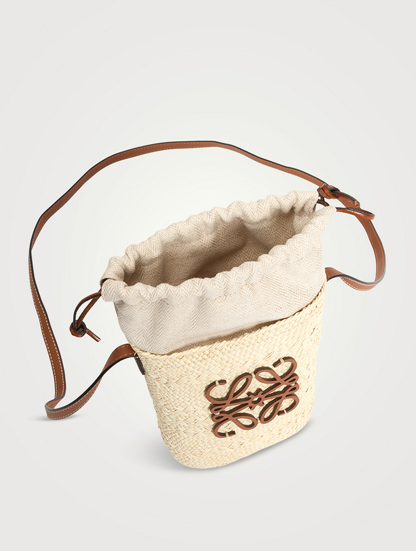 Loewe paula's ibiza pochette leather-trimmed woven raffia shoulder bag. # loewe #crossbody #bags