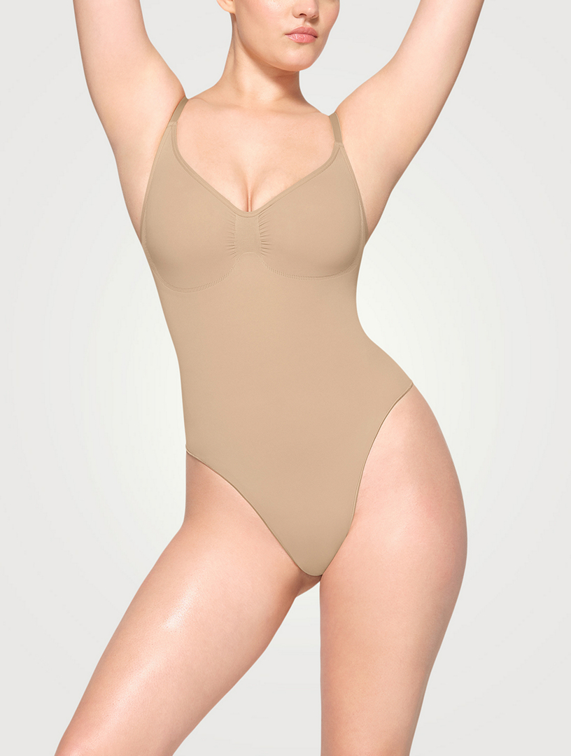 Skims Seamless Sculpt Low Back Thong Bodysuit In Brown