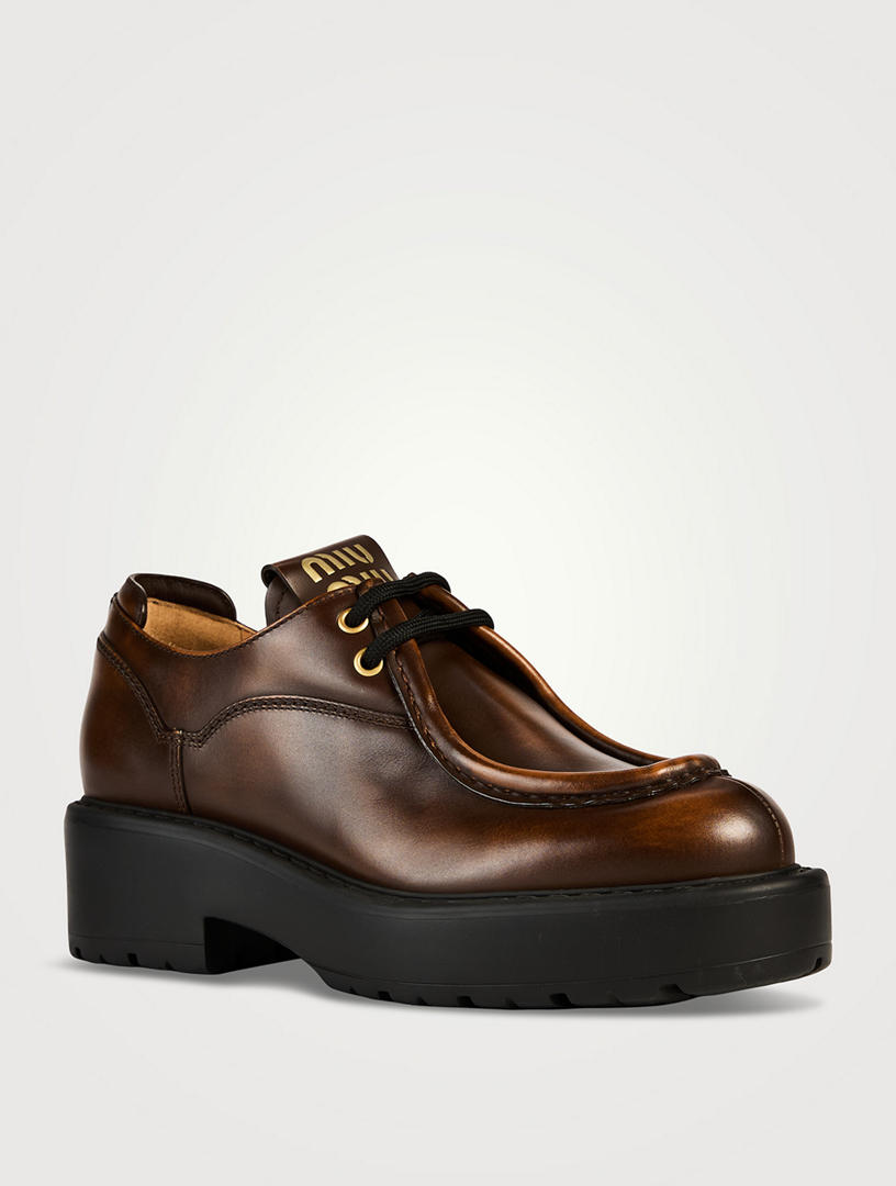MiuMiu Leather Lug-Sole Wallabies ラグソール ワラビー ロゴ MIU MIU Leather Lug-Sole Wallabies | Yorkdale Mall
