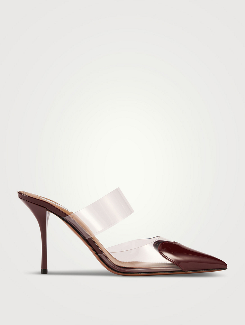 ALAÏA Mules Heart en cuir verni et PVC | Holt Renfrew