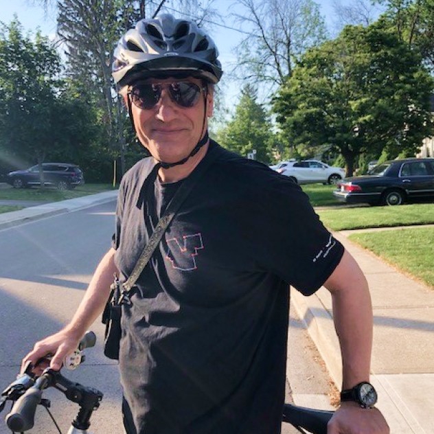 Lorenzo smiling for the camera on a break during a bike ride.