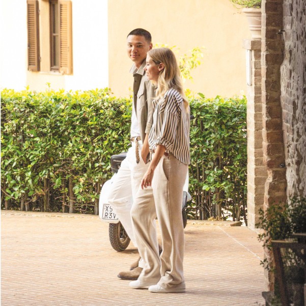 Joseph Tang and Carolina Cucinelli walking in Solomeo.