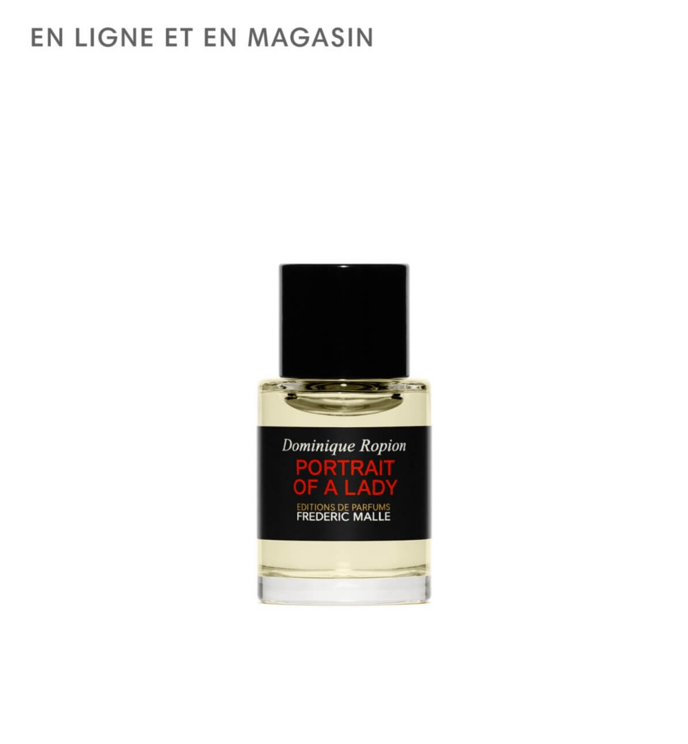 Flacon de parfum miniature avec bouchon et étiquette noirs