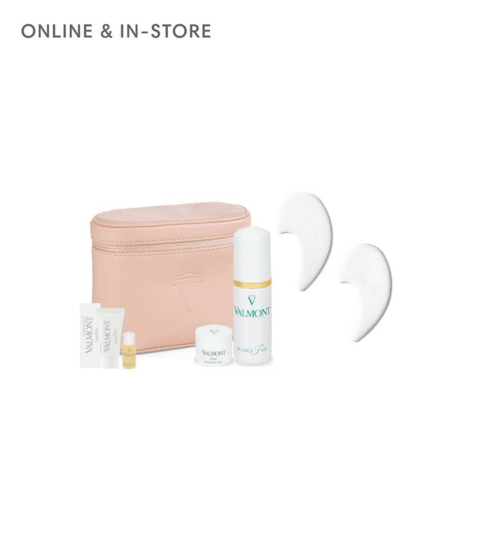 A pink pouch surrounded by Valmont beauty products