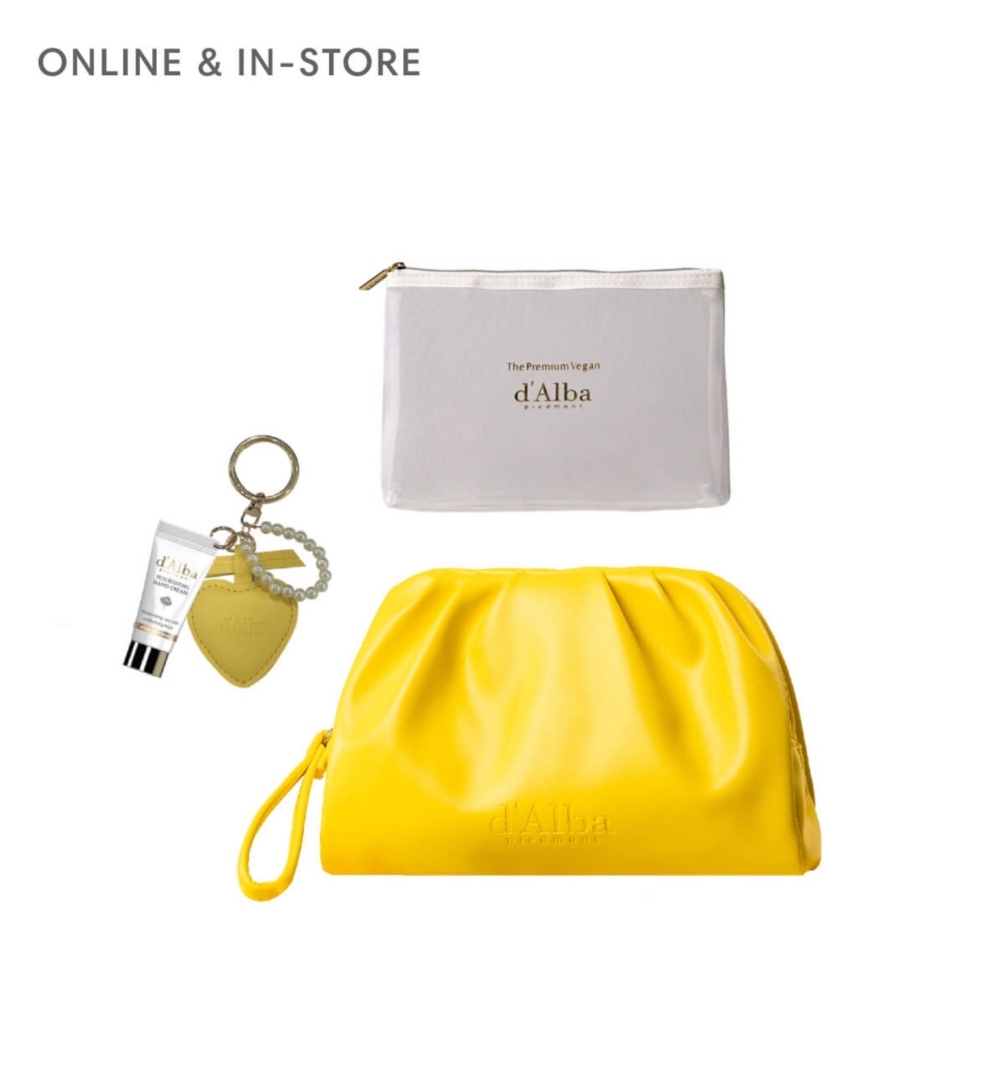 A yellow pouch srrounded by d'Alba beauty products