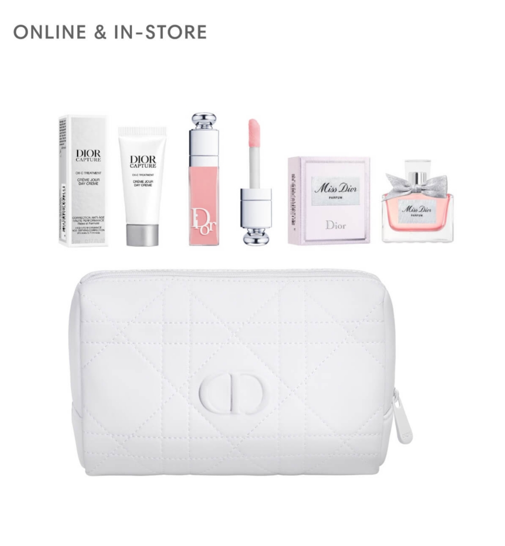 A Dior makeup bag surrounded by makeup samples