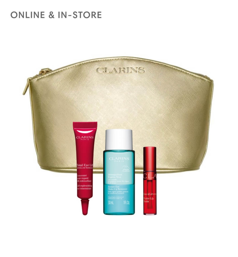 A gold pouch surrounded by miniature Clarins products