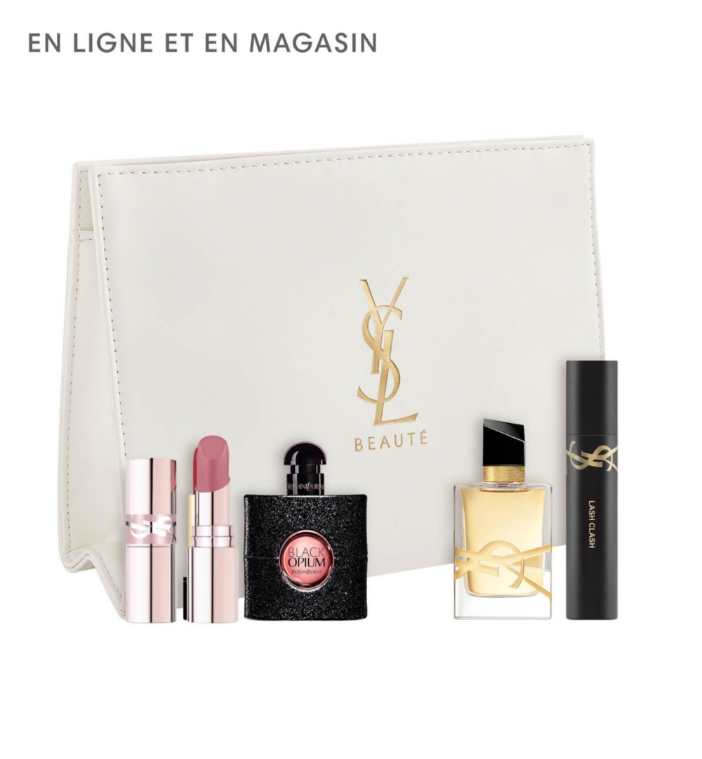 Une pochette entourée de produits de beauté Yves Saint Laurent