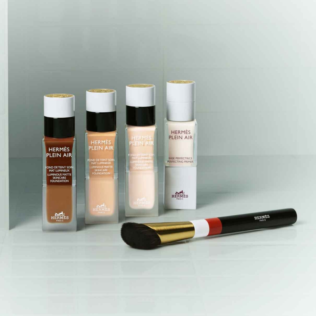 Lineup of two tone hermes packages and beauty products