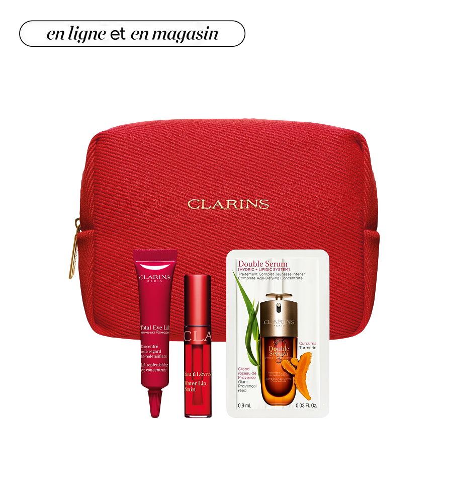 Une pochette rose clair entourée de produits de beauté Clé de Peau