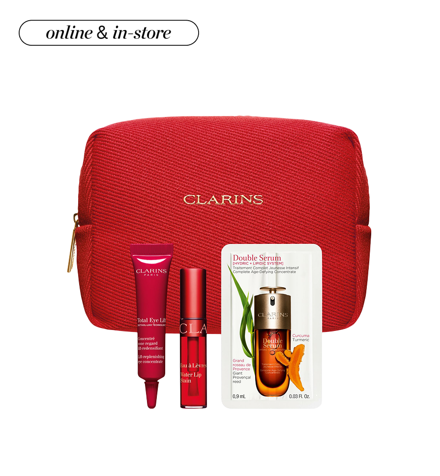 A light pink pouch surrounded by Cle de Peau beauty products