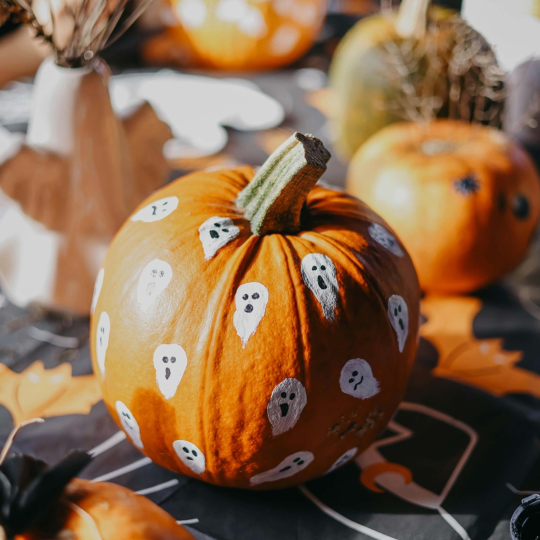 mini pumpkin painted with small ghosts