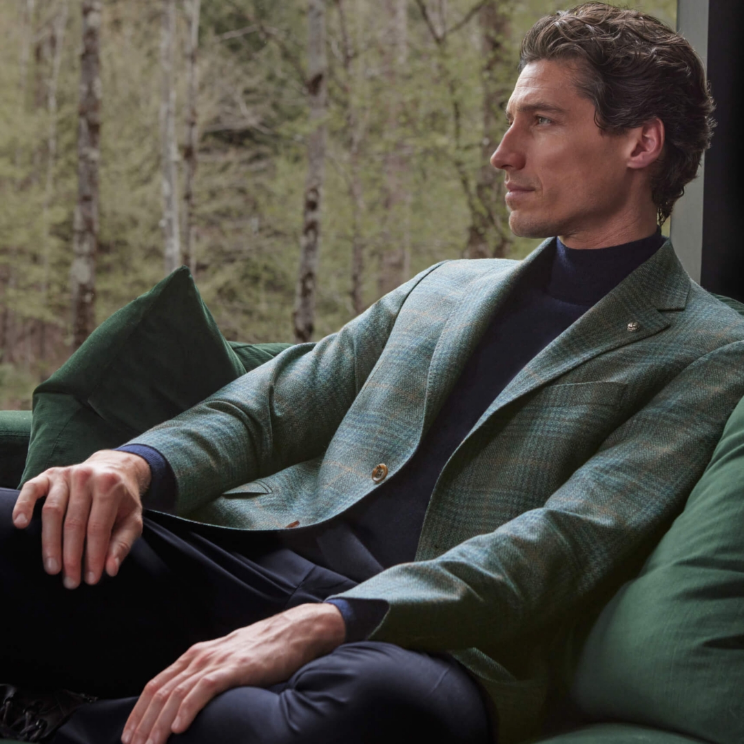 Two models pose in all white outfits.