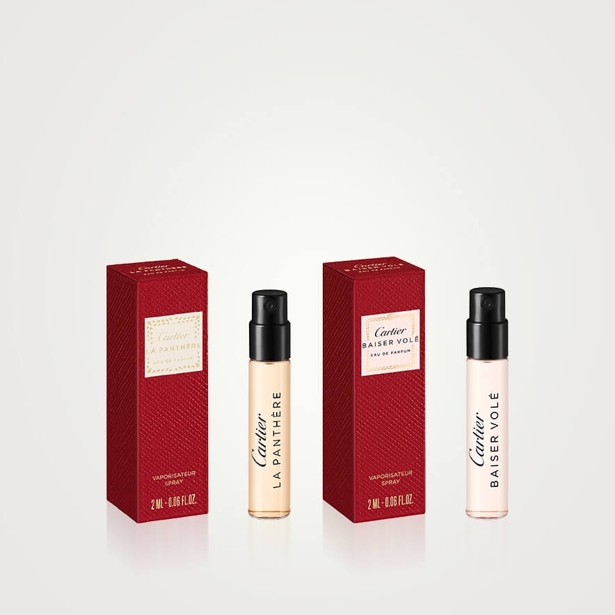 Cartier fragrances next to red boxes