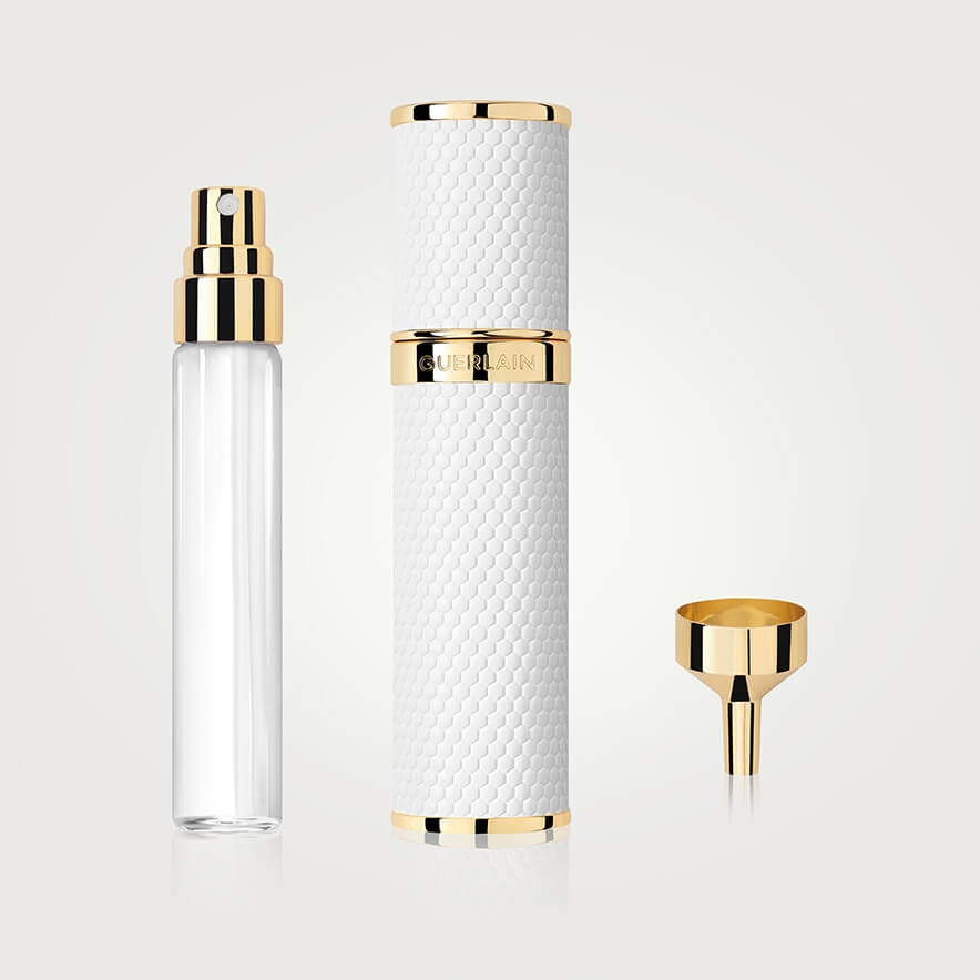 A white spray bottle with and embossed honeycomb pattern